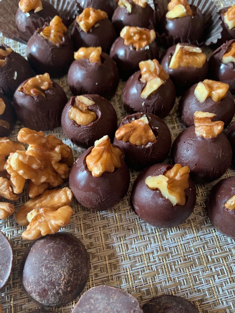 walnut truffles topped with halved walnut